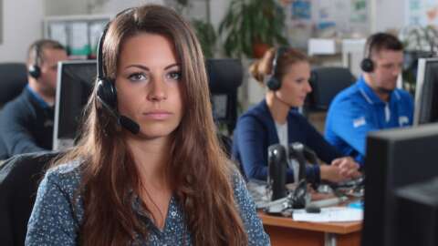 A busy office of a moving company focus on 3 people accepting customer calls A busy office of a moving company focus on 3 people accepting customer calls